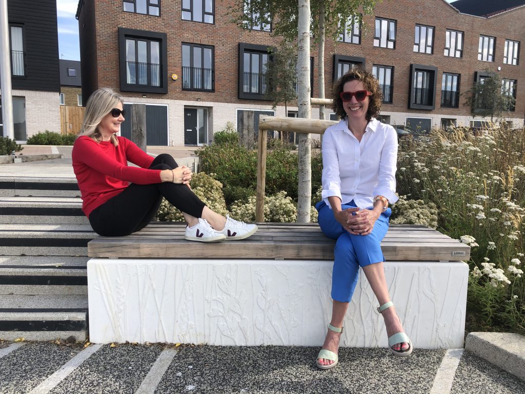 Laura and Louise sitting on a bench at Rochester Riverside