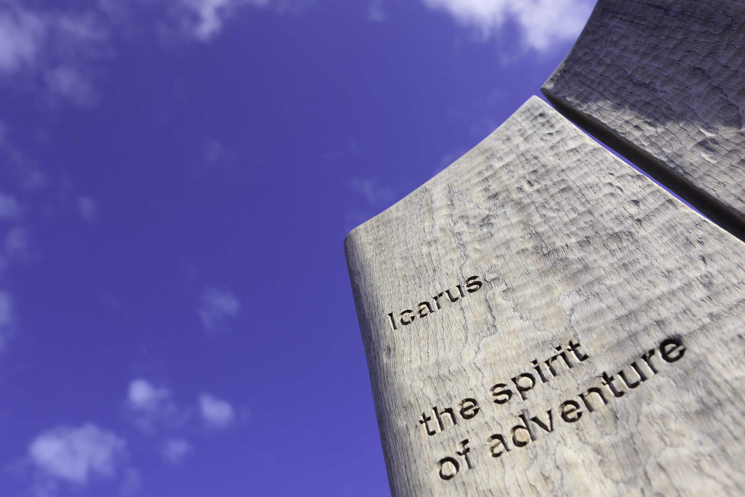 text on sculpture that reads Icarus, the spirit of adventure