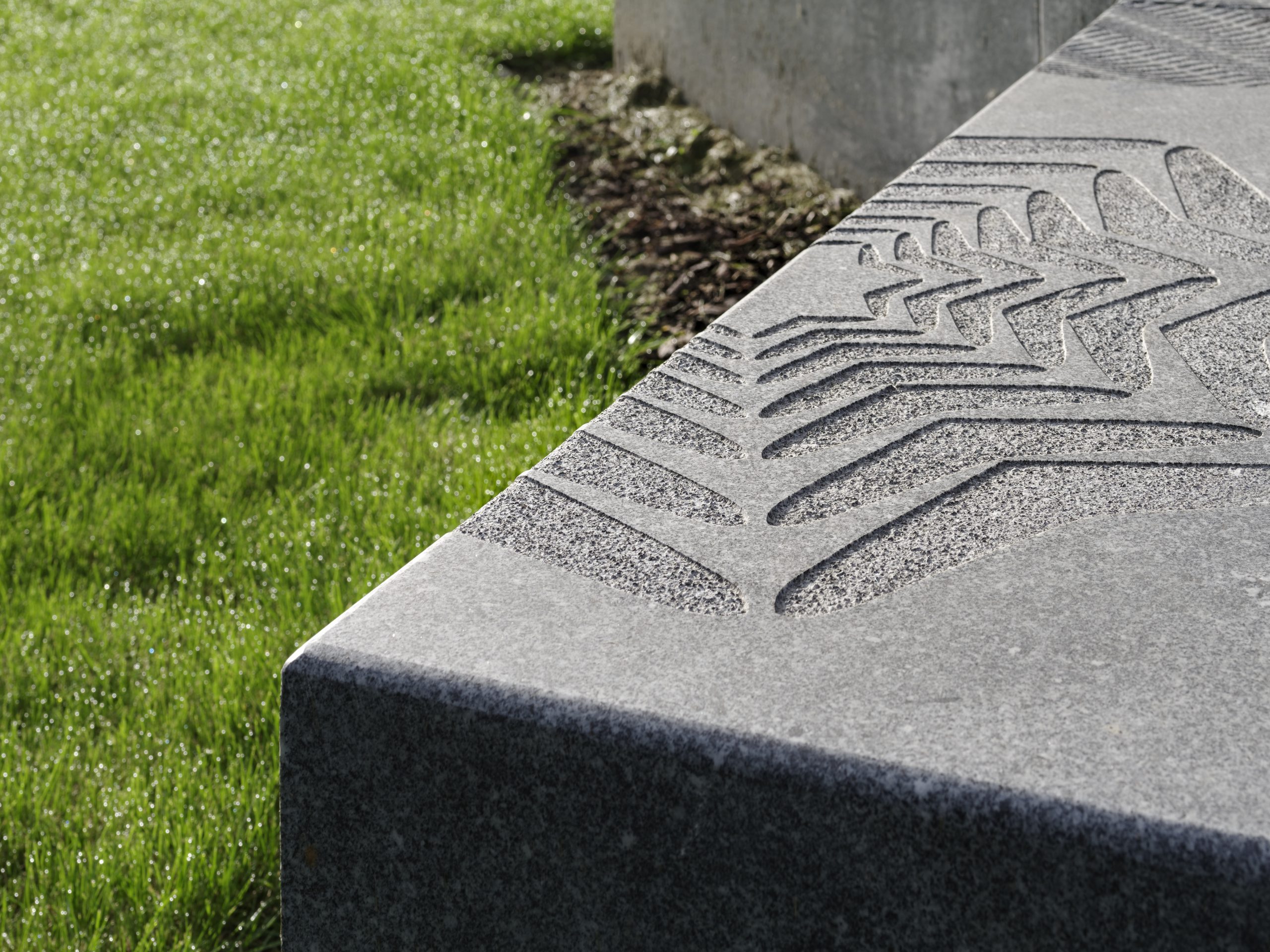 granite seat with sandblasted pattern detail