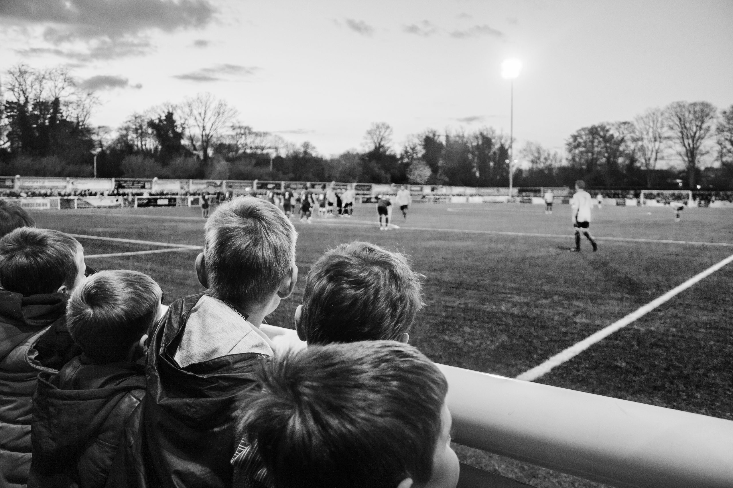 Inspired little boys watching football