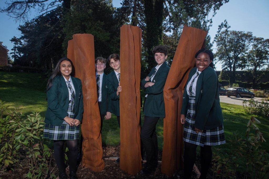 Valley Park pupils standing in between sculptures