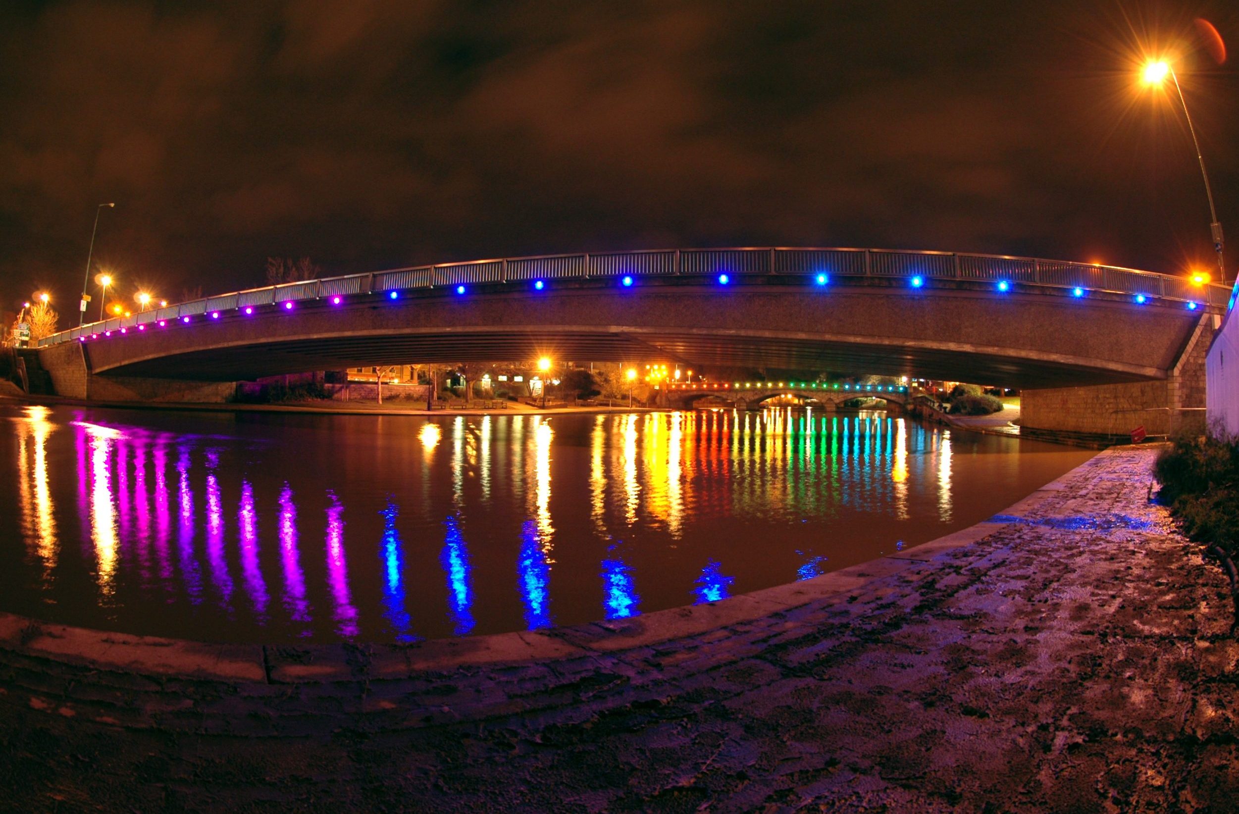 Illuminated bridge at night