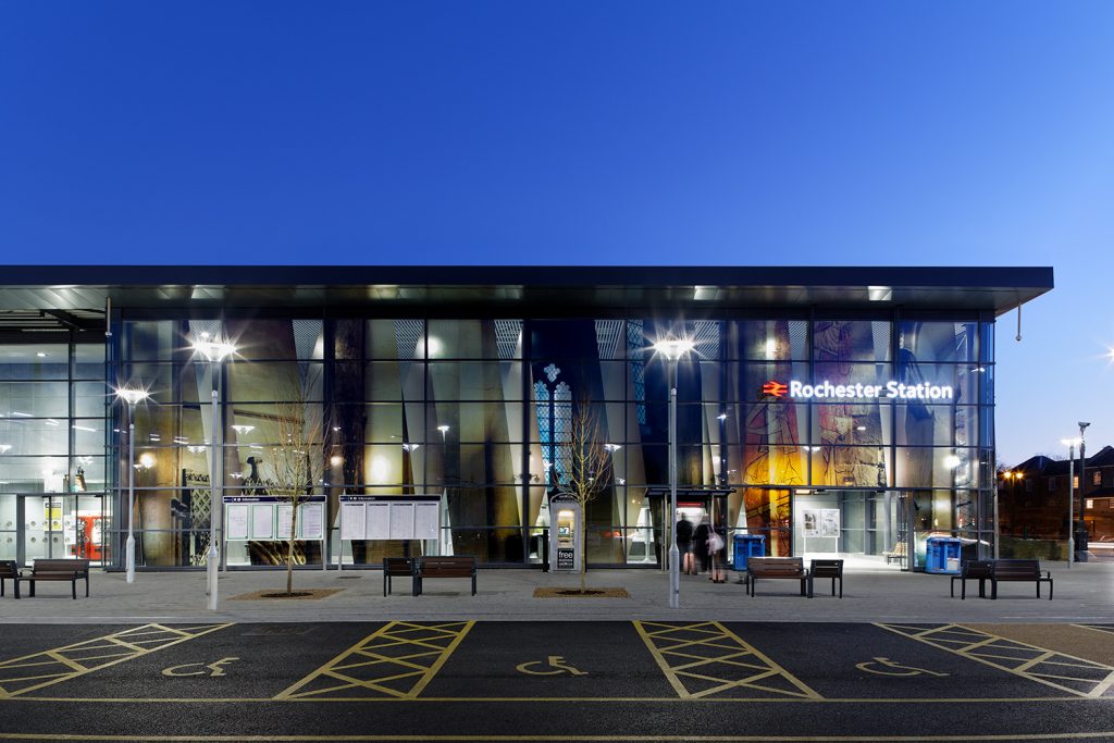 Rochester Station at dusk with vinyl artwork on glass elevation